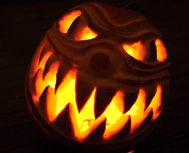Scary 3d carved pumpkin with spooky clown face