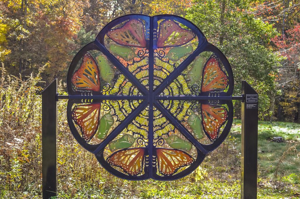 metal sculpture with butterflies